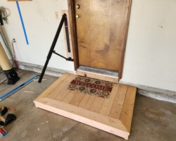 Garage step with folding RV handle